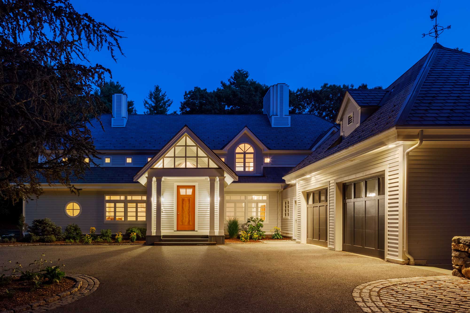 Single-story home with large driveway and two-car garage